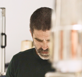 Equipment Engineer inspects Magic Leap AR glasses, showcasing lightweight design and waveguide optics.